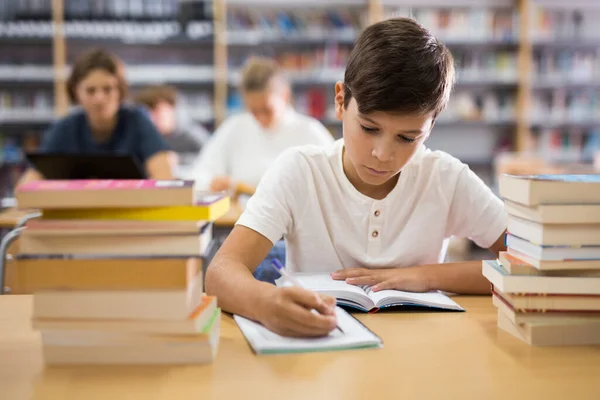 Young Boy Sitting Table Reading Room Library Doing Homework — Stockfoto