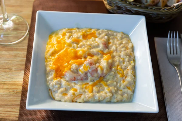 stock image Tasty gratin risotto with prawns baked in oven with cheese until appetizing crust