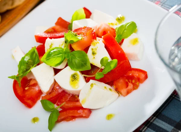 Mediterranean Food Caprese Salad Tomatoes Mozzarella Cheese Basil Pesto White — Stock Photo, Image