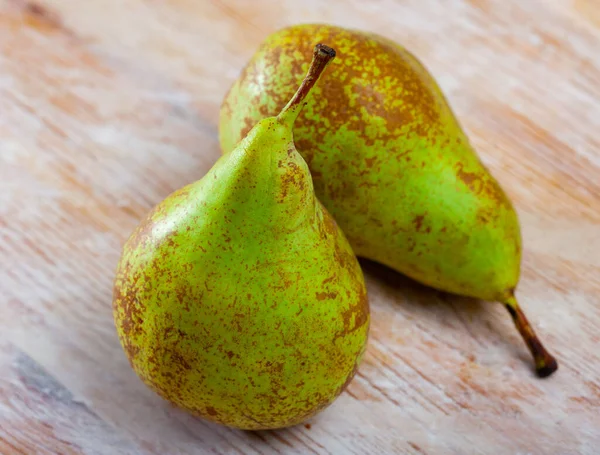 stock image Juicy flavorful pears on natural wooden background..