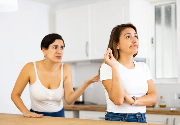 Frowning Young Hispanic Woman Standing Home Kitchen Listening Listlessly Reprimanding — Stock Photo, Image