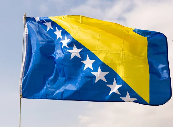 Large Flag Bosnia Herzegovina Fixed Metal Stick Waving Background Cloudy — Stock Photo, Image
