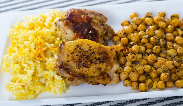Delicious Roasted Chicken Thighs Garnished Chickpeas Yellow Rice White Dish — Stock Photo, Image