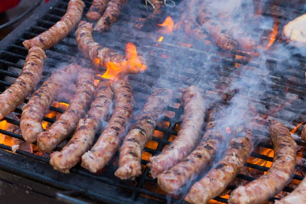 Tasty Sausages Being Cooked Flaming Charcoal Grill Meat Dishes Outdoor — Stock Photo, Image