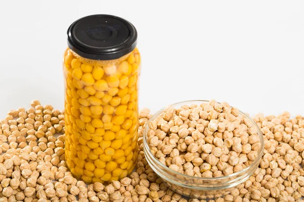 Glass Jar Boiled Chickpeas Bowl Raw Chickpea Grains White Surface — Stock Photo, Image