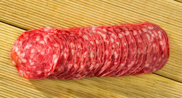 Traditional Spanish Salchichon Sausage Slices Wooden Background — Φωτογραφία Αρχείου