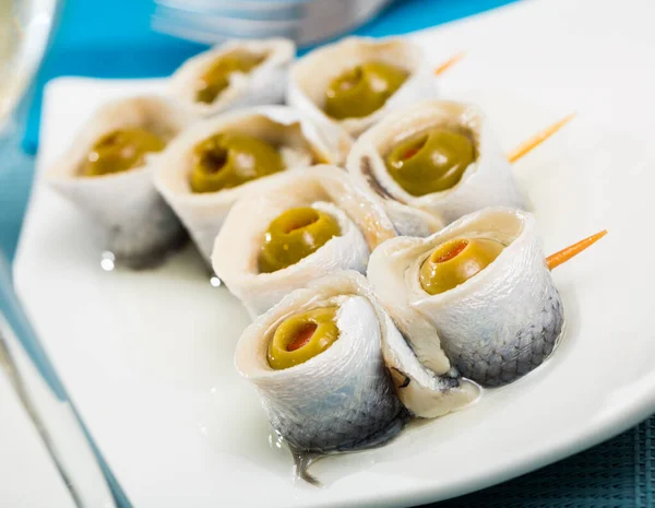 Appetizing Pickled Herring Rolls Stuffed Olives Served White Plate — Stock Photo, Image