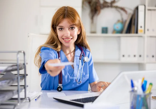 Positive Woman Physician Sitting Table Her Office Giving Recipe — Stock Photo, Image