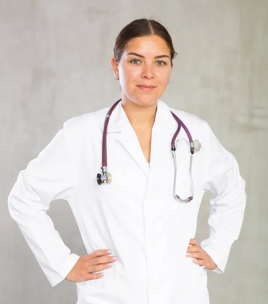 Friendly Young Female Professional Doctor White Coat Posing Gray Studio — Stock Photo, Image
