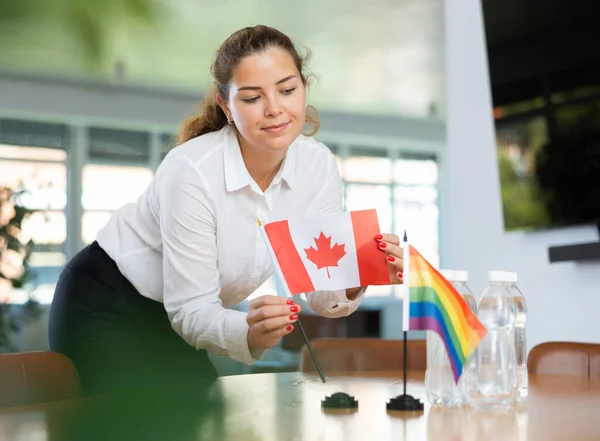 Young Woman Business Clothes Puts Flags Canada Lgbt Negotiating Table — Stock Photo, Image