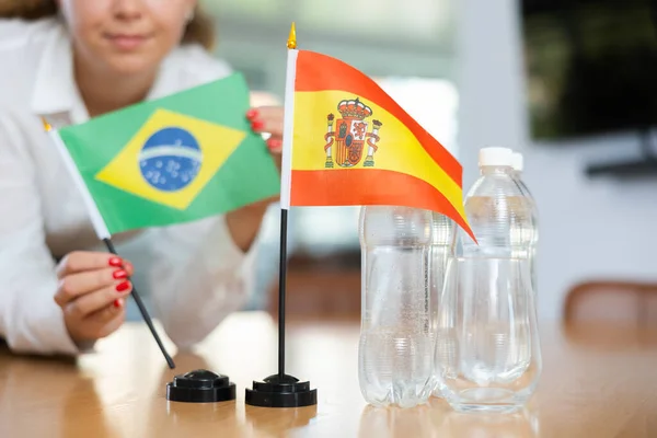 Little Flag Spain Table Bottles Water Flag Brazil Put Next — Stock Photo, Image