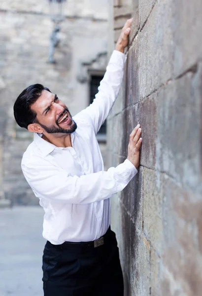 Handsome Bearded Man Trying Climb Stone Wall His Beloved — Stock Photo, Image