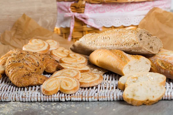 Various Bakery Pastry Products Rattan Mat Wooden Table — Stock Photo, Image