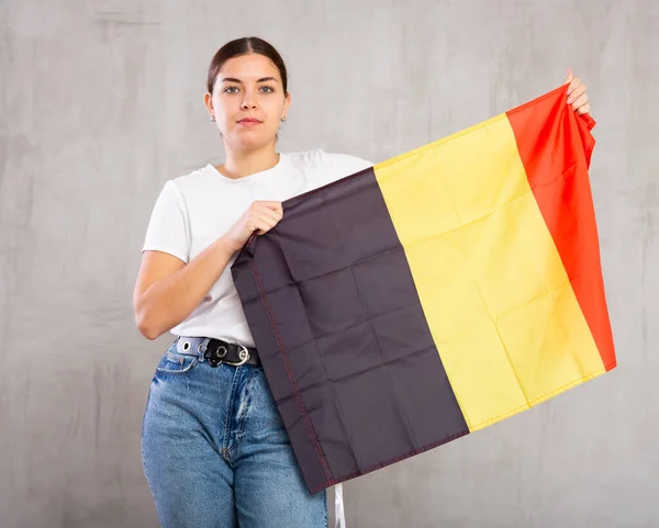 Young Serious Woman Holding National Flag Belgium Her Hands — Stock Photo, Image