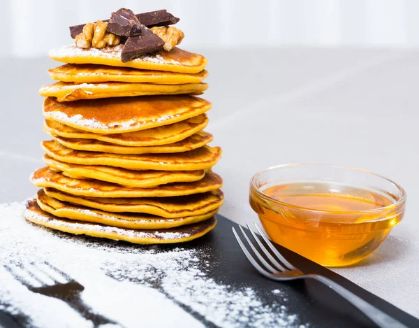 Stack Delicious Pancakes Black Plate Chocolate Walnuts Honey — Stock Photo, Image