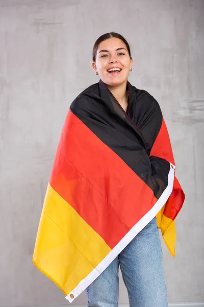 Happy Girl Stands Flag Germany Isolated Gray Background — стоковое фото