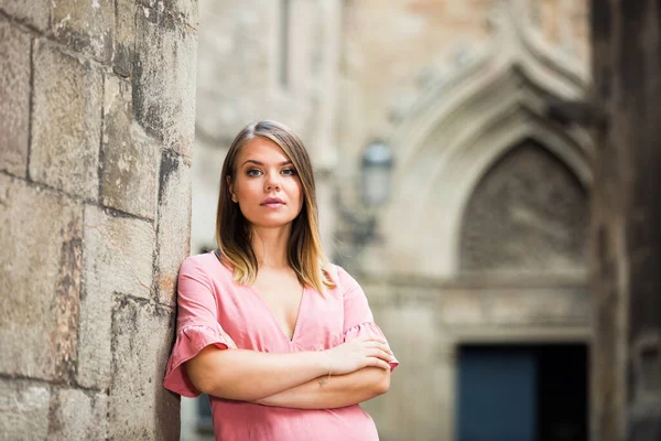 Positive Young Woman Standing Old Stone Wall While Strolling City — Stock Photo, Image
