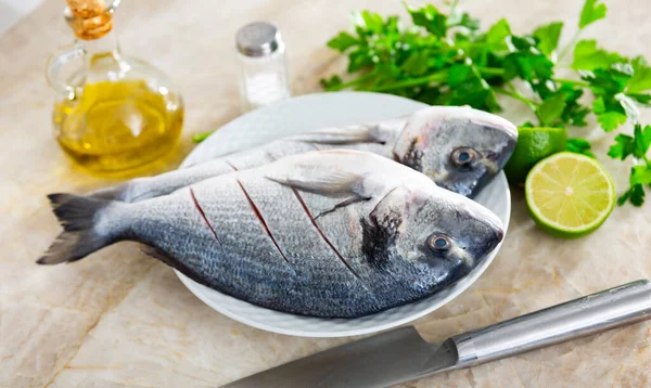 Two Raw Gilt Head Bream Laid Plate Lime Parsley Salt — Stock Photo, Image