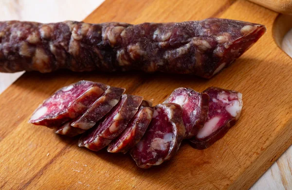 stock image Traditional French dried sausage on cutting board. High quality photo