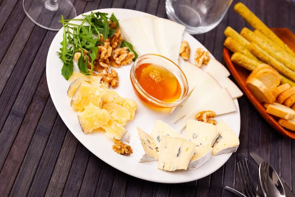 Various Types Sliced Cheese Served White Plate Honey Walnuts — Stock Photo, Image