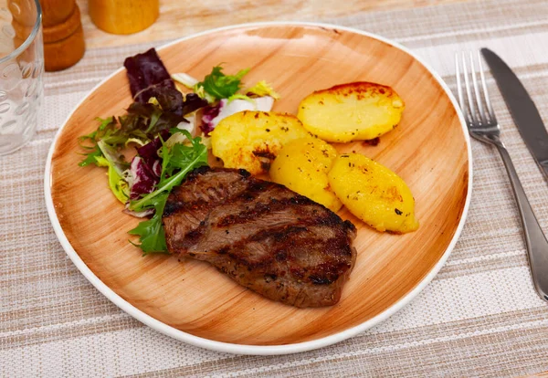 Appetizing Grilled Beef Strip Steak Served Baked Potato Slices Garnished — Stock Photo, Image