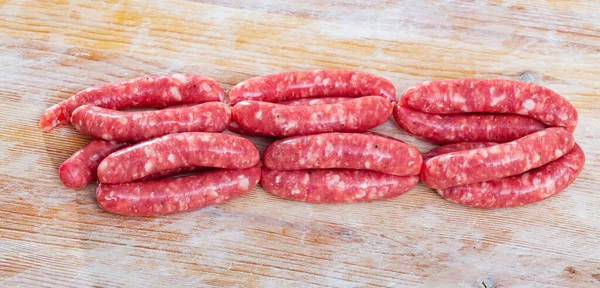 Fresh Raw Pork Sausages Ready Grilling Wooden Background — Stock Photo, Image