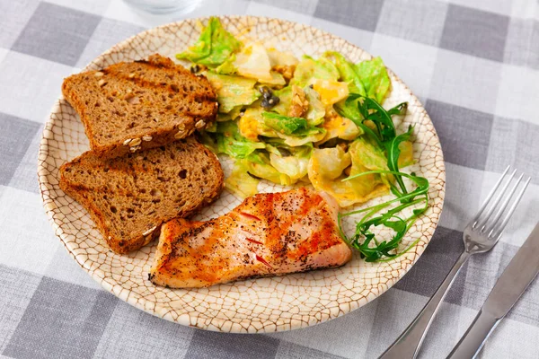 Appetizing Baked Salmon Steak Spices Delicious Vegetable Salad Served Bread — стоковое фото