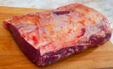 close up of pieces of marbled beef on wooden table clipart