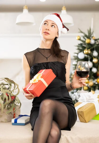 Romantic Girl Santa Hat Sits Kitchen Table She Holds Gift — Stock Photo, Image