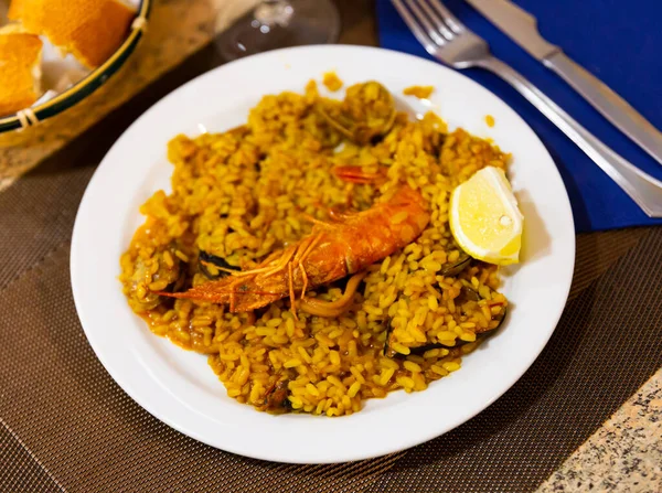 Paella Made Rice Different Seafood Served White Plate Other Table — Stock Photo, Image