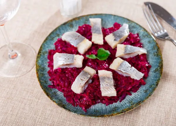 stock image Delicious sliced lightly salted herring with beets served on platter