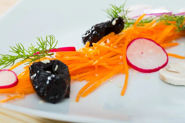Image Salad Fresh Carrot Radishes Prunes Served Plate Greens — Stock Photo, Image
