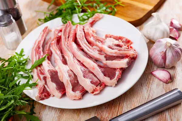 Fresh Uncooked Lamb Chops Plate Arugula Garlic — Stockfoto