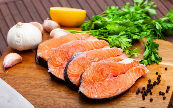 Fresh Sliced Steaks Salmon Herbs Lemon Wooden Kitchen Board — Stock Photo, Image