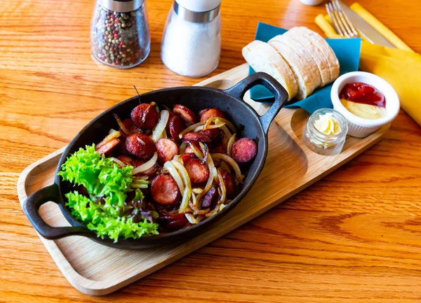 Appetizing Fried Sausages Onions Served Iron Frypan Sauces Fresh Bread — Stock Photo, Image
