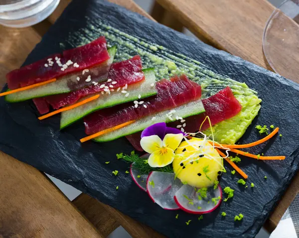 Mediterranean Tuna Carpaccio Served Cucumber Guacamole Decorated Radish Slices Flowers — Stock Photo, Image