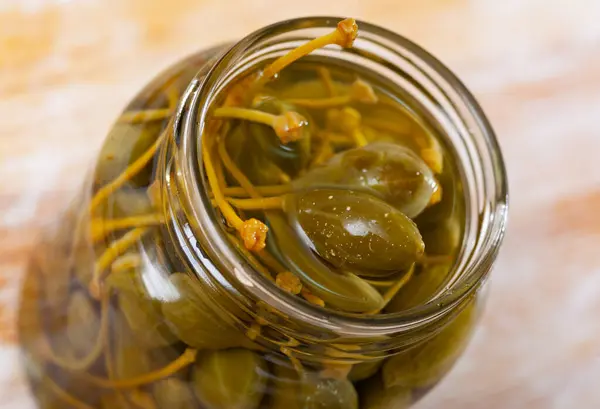 Closeup Glass Jar Pickled Green Capers Wooden Background — Stock Photo, Image
