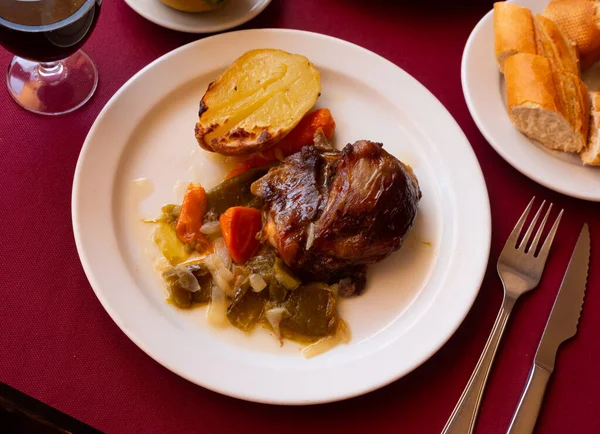 Pork cheeks stewed with vegetables and potatoes. Spanish traditional food.