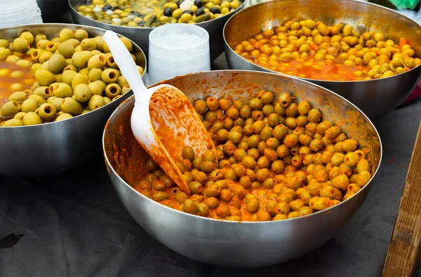 Containers Filled Pitted Green Spanish Olives Marinated Spices — Stock Photo, Image