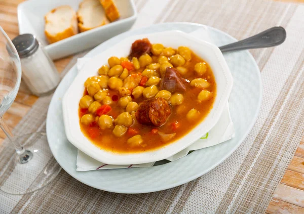 Cocido Madrileno is classic Spanish lunch with meat, chickpeas and vegetables