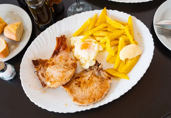 Dish Spanish Cuisine Juicy Pork Chop Potatoes Egg — Stock Photo, Image