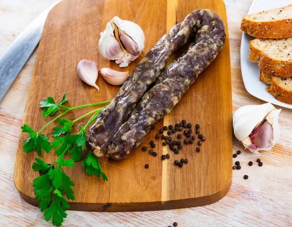 Dried Pork Meat Sausage Served Wooden Table Parsley Peppercorns Garlic — Stock Fotó