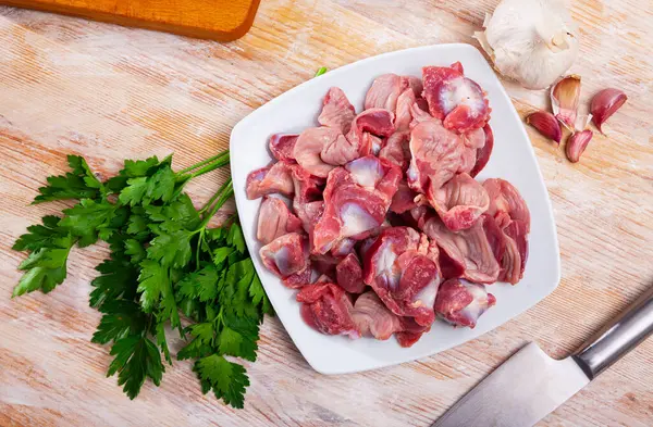 Raw Chicken Gizzards Served Plate Wooden Table Herbs Garlic — Stock Photo, Image