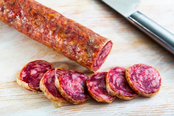 Traditional Spanish Dry Cured Pork Sausage Salchichon Sliced Wooden Background — Stock Photo, Image