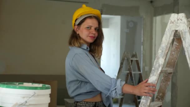 Young Seductive Woman Wearing Revealing Clothes Hardhat Posing Stepladder Apartment — Stock Video