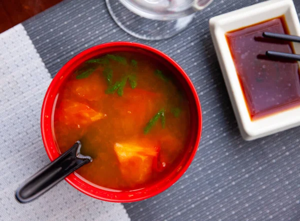 Spicy tomato soup in red bowl, japanese cuisine