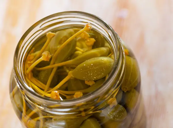 Closeup Glass Jar Pickled Green Capers Wooden Background — Stock Photo, Image