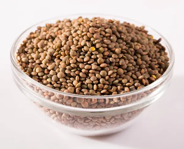 Lentils Glass Cup White Surface High Quality Photo — Stock Photo, Image