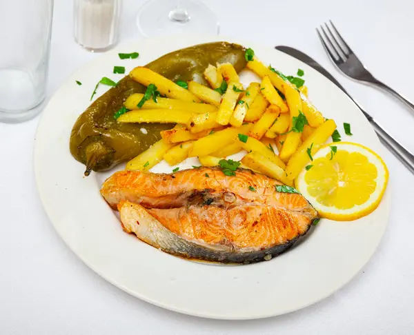 Traditional spanish food, salmon con pimiento y patata, roasted salmon with potato and pepper