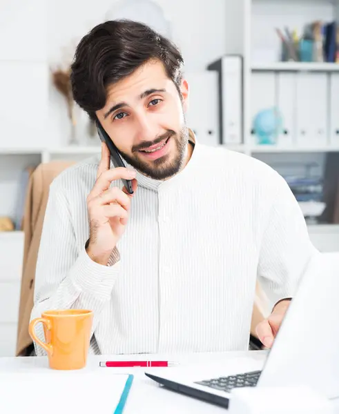 Young Handsome Male Office Worker Talking Mobile Phone Table Office — Stock Photo, Image
